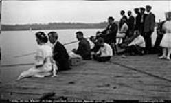 Fishing off the wharf, Lake Joseph, Muskoka Lakes ca. 1908