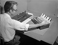 Norman McLaren, National Film Board animator, selecting (?) Synthetic Sounds July 1955