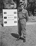 CANADIANS IN GERMANY. Lt.Col. Albert F. Coffin, Officer Commanding the Canadian Berlin Battalion in front near battalionheadquarters 19-Jul-45