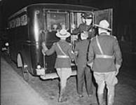 Royal Canadian Mounted Police (R.C.M.P.), Montreal Police and prisoner getting into Paddy Wagon 10 Sept. 1939