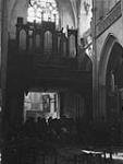 French civilians awaiting evacuation inside a church 17 Aug 1944