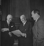 (l-r) Merchant Mahoney, C.B.E., Ambassador the Hon. Leighton McCarthy, K.C., and Lester B. Pearson, O.B.E. at the Canadian Embassy December, 1943.