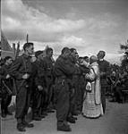 French-Canadian personnel taking part in a Mass celebrating Bastille Day 13-Jul-44