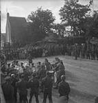 Band of the 2nd Canadian Corps playing at an outdoor Mass celebrating Bastille Day at the Church of St. Ouen de Rots 13-Jul-44