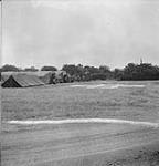 Tents and vehicles of the 14th Light Field Ambulance unit, R.A.M.C., awaiting casualties 08-Jul-44
