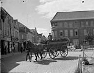 "A typical scene is a wagonload of peat as the town prepares for the long cold winter ahead as no coal will be available this year to civilians in Germany 26-27 Aug. 1945