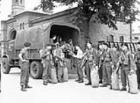 Captain C.H. Davis welcoming an incoming draft to No.1 Canadian Armoured Corps Reinforcement Unit, Woking, England, 8 August 1944 August 8, 1944.
