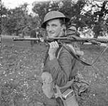 Private D.B. MacDonald of The Royal Canadian Regiment, who carries a Bren light machine gun, near Campobasso, Italy, October 1943 October 1943.