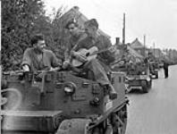 Universal Carriers of The Queen's Own Cameron Highlanders of Canada preparing to move from Germany to the Netherlands. Leer, Germany, 11 July 1945 July 11, 1945.