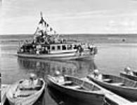 Prince Albert National Park - Motoboat QUEEN returns to Waskesiu pier from all-day cruise to Kingsmere Portage Aug. 1948