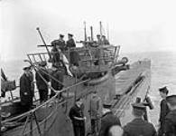 German submarine U-889 surrendering to the Fairmile motor launch Q117 of the Royal Canadian Navy off Shelburne, Nova Scotia, Canada, 13 May 1945 May 13, 1945.
