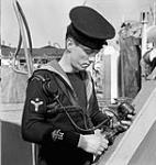 Stoker(M) E. Nixon, Royal Canadian Naval Volunteer Reserve (R.C.N.V.R.), aboard L.C.I.(L) 121 of the 1st Canadian (260th Royal Navy) Flotilla, England, March 1944 March, 1944