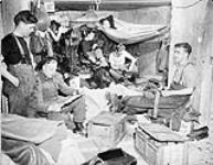 Personnel of the Royal Canadian Navy Beach Commando "W" in their quarters in the Juno sector of the Normandy beachhead, France, 20 July 1944 20-Jul-44