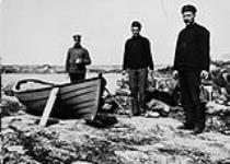 Constables Conway, Tremaine and Donaldson painting boat at Fullerton, N.W.T., July 1904 July, 1904