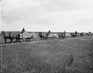Part of Lutheran colony from Nebraska [U.S.A.] leaving Scott, for Tramping Lake, Saskatchewan 1910