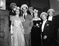 James Patrick Maloney (owner of the Standish Hotel) and wife Columbe and guests wearing paper hats on New Year's Eve ca 1941-1952.