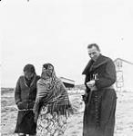 Bishop Lacroix with two Inuit girls 1948