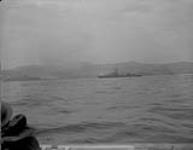 HMCS Nootka firing at target railway bridge 26 May 1951.