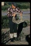 George Koneak with rope in his hands [between July 13-August 9, 1960]