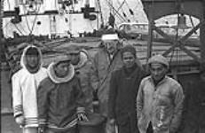 [Mackenzie Porter with a group of men on a boat, Iqaluit, Nunavut] [between 1956-1960]