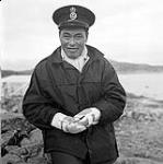 [Man wearing a sailor hat] [between 1956-1960]