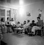 [People socializing at James and Alma Houston's house, Kinngait, Nunavut] 1960