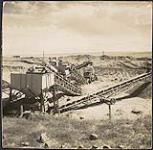 Gravel for the Trans-Canada Highway. Pit near Alberta border 1954.
