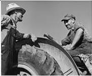 Farming Ontario, Oliver Moran and Welly Fenwick on a tractor 1942
