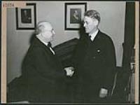 Hon. H.L. Ilsley, Canadian Minister of Finance, greets Dr. Pavlasek, Czechoslovakian Minister to Canada, Ottawa March 1945