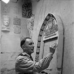 William Oosterhoff with sculpture [ca. 1954-1963].