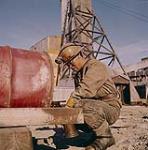 Inuk man working at a mine 1961