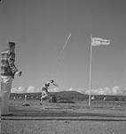 Highland Games, Antigonish, 1940, athlete throwing a javelin August, 1940