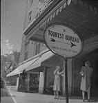 Halifax, two women outside the Tourist Bureau at Lord Nelson Hotel [ca. 1939-1951].