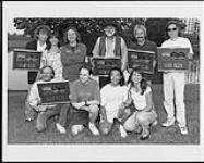 Tractors receiving album awards - (left to right, top row) Walt Richmond, Jill Snell (Manager, Artist Marketing), Steve Ripley, Casey Van Beck, Ron Getman, Jamie Oldaker, (bottom row) Barry Haugen (BMG Music Sales Rep), Dale Peters (Ontario Promotions Rep), Brian Low (Ontario Customer Service Rep), Shelley Snell (Assistant Manager, National Media Relations) [ca 1994].
