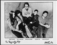 Publicity portrait of The Tragically Hip sitting on a canvas backdrop - (left to right) Bobby Baker, Paul Langlois, Gordon Downie, Johnny Fay, Gord Sinclair n.d.