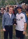 Tal Bachman receiving a SOCAN #1 plaque for his song "She's So High," presented by Michael McCary of SOCAN [entre 1999-2000].