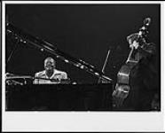 Oscar Peterson with an unidentified double bass player, at the Montreux Jazz Festival [between 1975-1980].