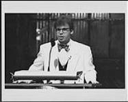 Juno Host Rick Moranis speaking at the podium. Juno Awards 1992 1992