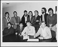 Toronto band New Regime celebrate the signing of a recording contract with RCA Inc. Pictured left to right are: RCA's National Sales Manager Tim Williams, New Regime's Co-Manager Jake Gold, New Regime members Russ Walker, Norm McMullen, RCA's Director of A&R Jim Fotheringham, New Regime's Co-manager Dave Kirby, and RCA's Manager of National Promotion Ken Bain. Front row, left to right: RCA's Jim Campbell, and New Regime's Neil Taylor, Kevin Connelly, and Rick Linthrop [between 1984-1985]