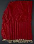 Red velvet drape with gold tassels ca. 1950-1951.
