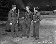Sergeant Lalonde, bomb aimer, Sergeant Nault, Navigator and Sergeant Rochon, Air Gunner beside Wellington 2 May 1944.
