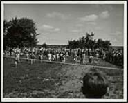 [Children racing at family picnic] 1953
