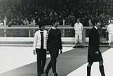Nancy Greene (centre) walking up to podium to receive her gold medal at the 1968 Winter Olympics February 1968
