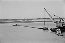 [Dredging equipment and boats on the St. Clair River] [between 1960-1962]
