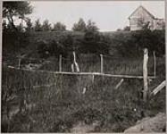 [John Jamieson Jr. using a footbridge] 1914