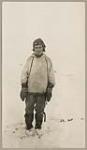 [Pukwee, Innu of Emish (Voisey's Bay), wearing snow goggles and beaded mittens] [between 1921-1922].