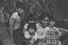 [Portrait of Pitseolak Ashoona with her grandchildren] November 1980