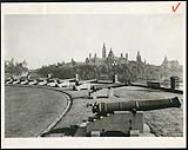 [Ten cannons on display at Major's Hill Park with Parliament buildings in background] [1927-1932].