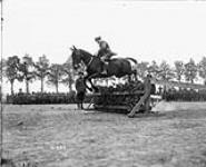 Jumping competition - Lieut. - Col. Rogers (Canadian Corps Horse Show - Reningelst, Belgium). July 19, 1916. July 19, 1916