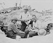 Sister Susie's brothers mending shirts which Sister Susie stitched. May 1917.